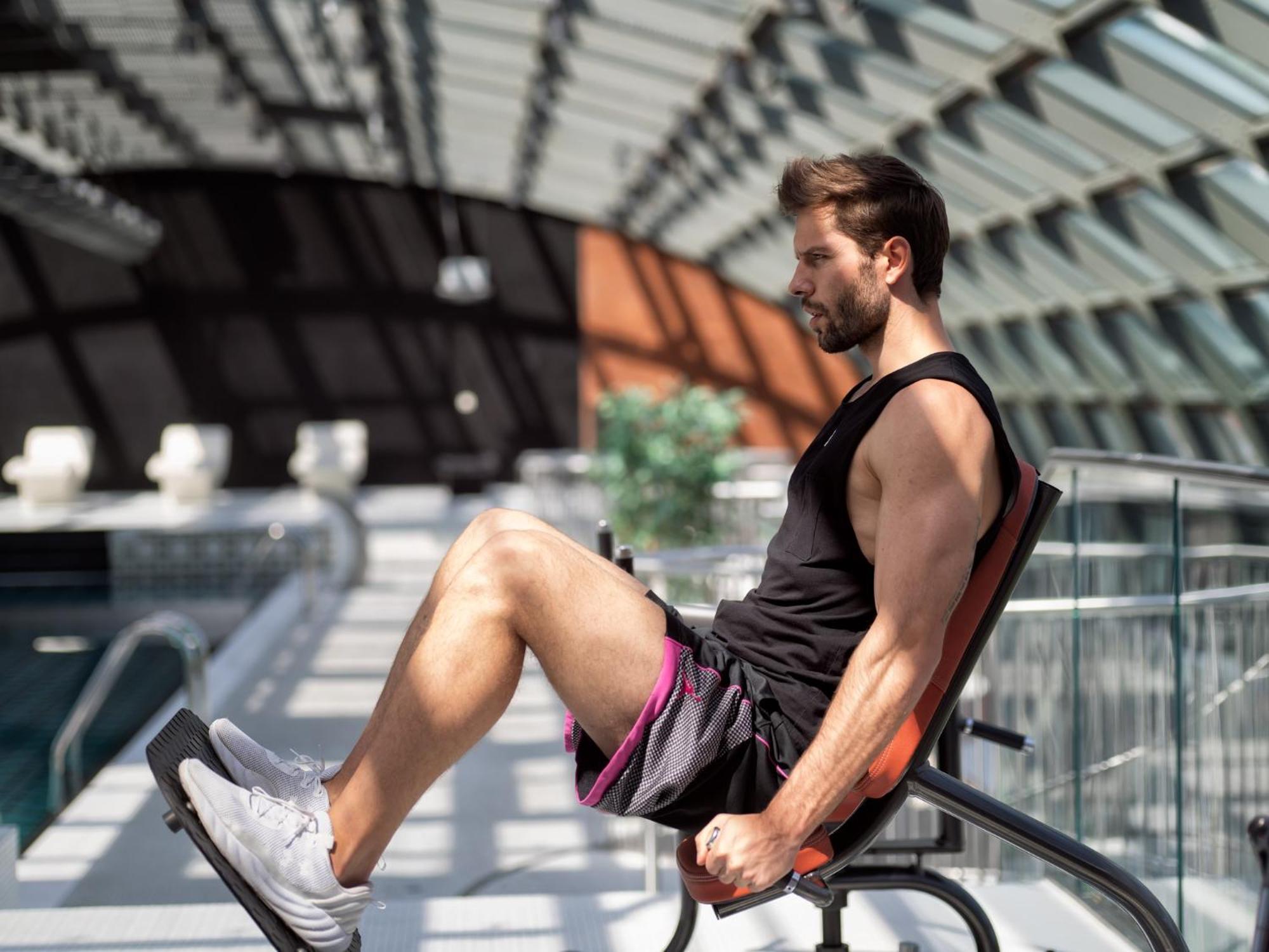 City Park Hotel & Residence Poznan Bagian luar foto A man riding a moving chair